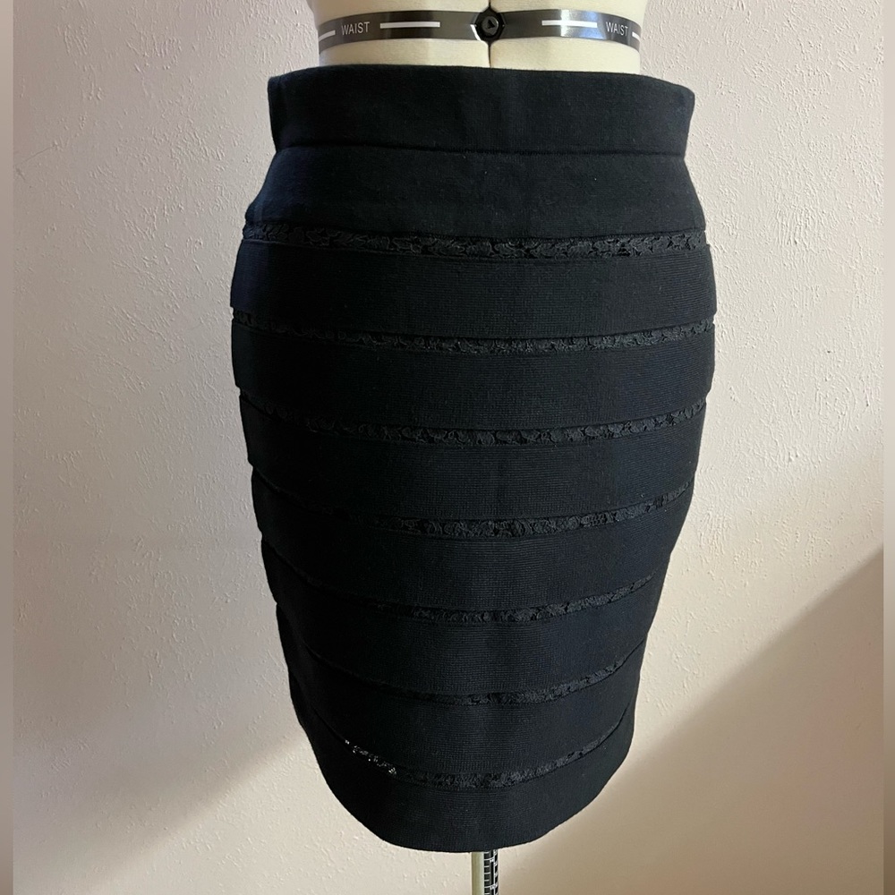Ann Taylor black pencil skirt, size S. Made of stretchy knit with peekaboo lace.